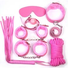Cele 7 piese ale kitului BDSM Fetish B-Series roz, asezate individual: catuse maini, catuse picioare, zgarda cu lesa, minge cu chinga, bici, masca pentru ochi, franghie