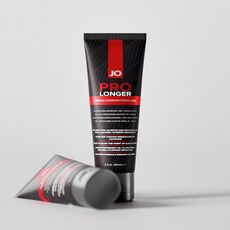 Tuburi System JO Prolonger Gel, unul asezat pe fundal deschis