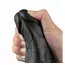 Vibratorul Real Softee tinut in pumn, aratand grosimea reala si diametrul de 5,1 cm