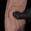 Deget apasat in corpul dildo-ului Nature Cock, aratand flexibilitatea stratului exterior de silicon