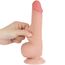 Deget apasat in tija dildo-ului Lovetoy Sliding Skin, aratand moliciunea stratului exterior