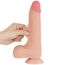 Deget apasat in tija dildo-ului Lovetoy Sliding Skin 8.5 inch, aratand moliciunea stratului exterior