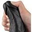 Vibratorul Real Softee tinut in mana, aratand flexibilitatea materialului TPE
