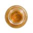 Ulei de masaj Sensual Golden Shimmer by Geisha, sticla asezata pe fundal cu picaturi de ulei auriu